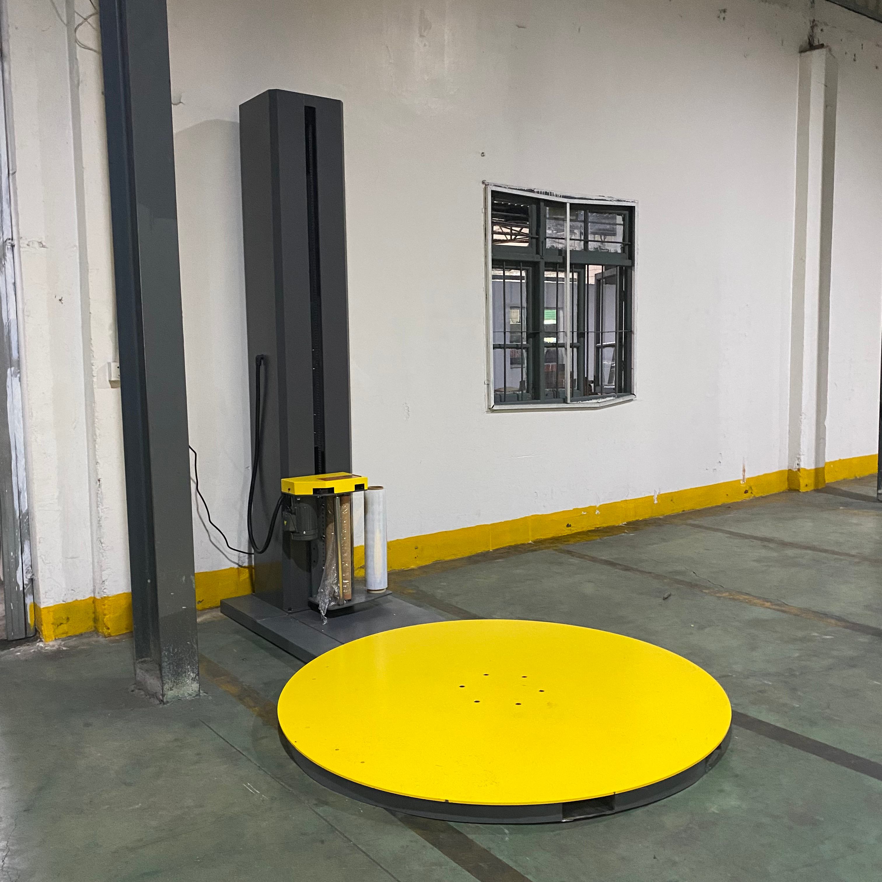 New automatic stretch wrapping machine at Elisha's production facility.jpg New automatic stretch wrapping machine at Elisha's production facility.jpg